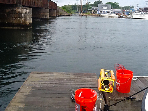  FSI’s ACM being deployed from Eastwinds Lobster and Grill dock in Buzzards Bay, MA. Buckets contain computers and wifi devices for data transmission.