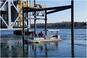 Soroush Kouhi listening to the Teledyne ADCP chirping at the boat ramp.