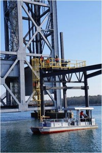 URI and MRECo crew installing water level senor atop the BTTS Platform.